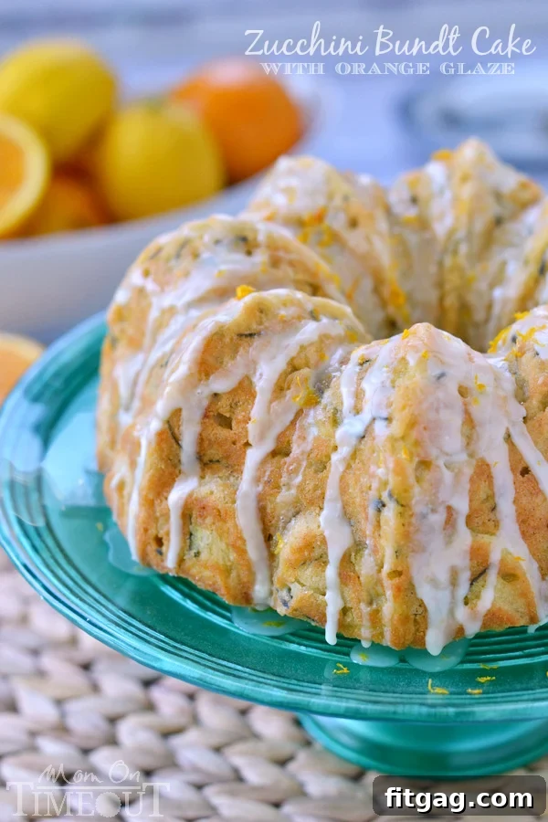 Garden-Fresh Zucchini Bundt 6 A whole Zucchini Bundt Cake with Orange Glaze, ready to be served, making a beautiful addition to any meal.