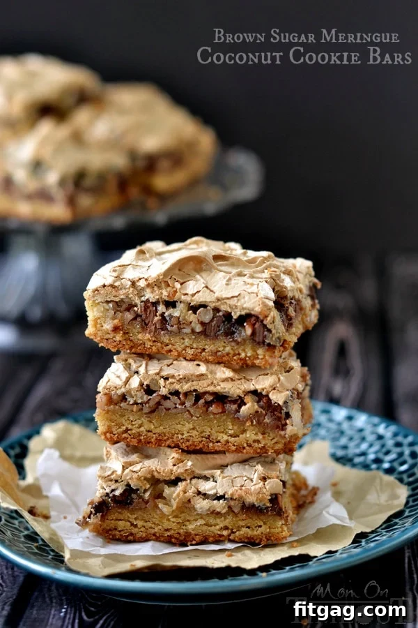 A freshly baked batch of Brown Sugar Meringue Coconut Cookie Bars cooling on a rack, ready to be enjoyed.