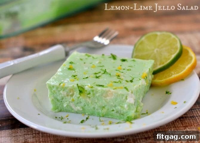 This delicious Lemon Lime Jello Salad is made with cottage cheese and pineapple - sooo good! | MomOnTimeout.com
