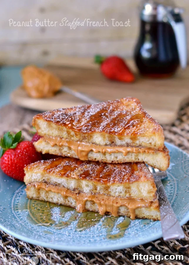 Close-up of Peanut Butter Stuffed French Toast with a fork, showing the creamy peanut butter filling