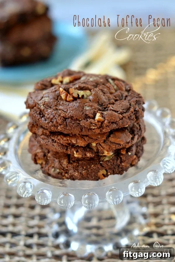 Unbelievably rich and fudgy, these bakery-style Chocolate Toffee Pecan Cookies are a chocolate lover's dream! | MomOnTimeout.com