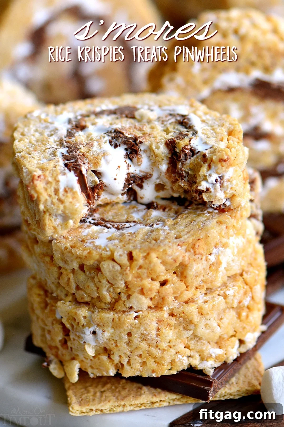 S'mores Rice Krispies Treats Pinwheels: A visually appealing, no-bake dessert featuring layers of marshmallow, chocolate, and graham cracker Rice Krispies rolled into spirals.
