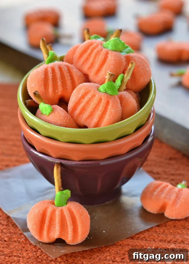 Delightfully easy Pumpkin Patties are the perfect no-bake treat to celebrate the season with. The cute factor here is off the charts! | MomOnTimeout.com | #recipe #pumpkin #candy #halloween #Thanksgiving