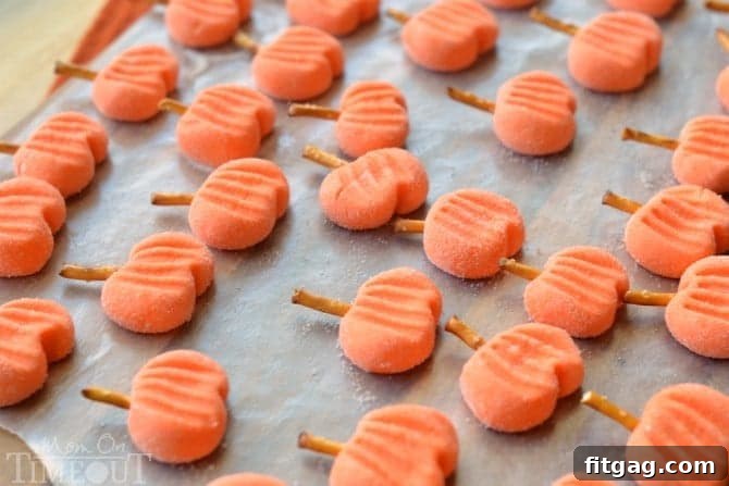 Delightfully easy Pumpkin Patties are the perfect no-bake treat to celebrate the season with. The cute factor here is off the charts! | MomOnTimeout.com | #recipe #pumpkin #candy #halloween #Thanksgiving