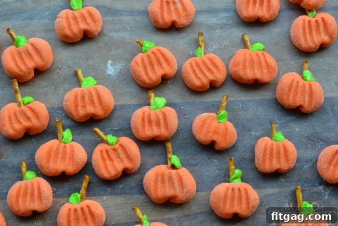 Delightfully easy Pumpkin Patties are the perfect no-bake treat to celebrate the season with. The cute factor here is off the charts! | MomOnTimeout.com | #recipe #pumpkin #candy #halloween #Thanksgiving