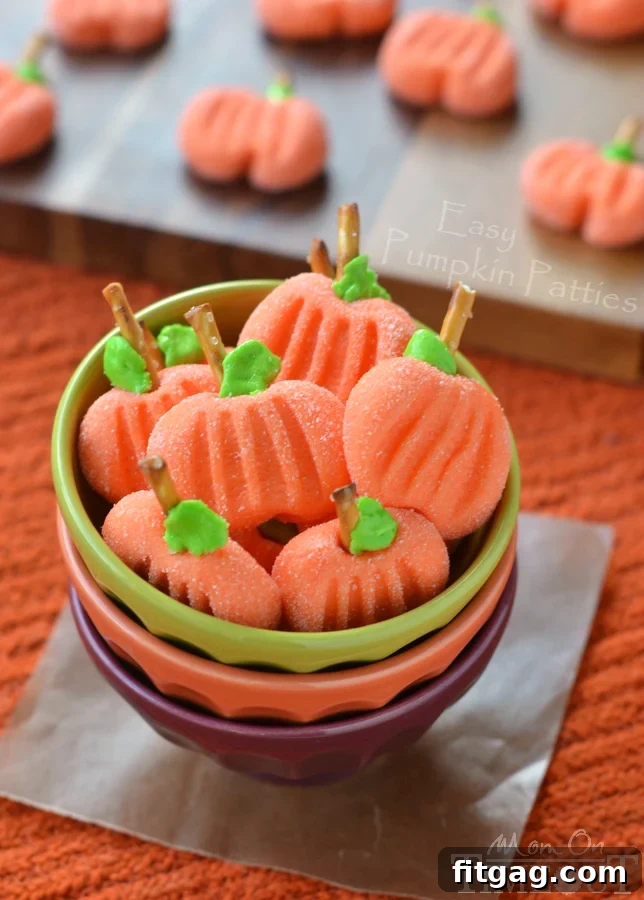 Delightfully easy Pumpkin Patties are the perfect no-bake treat to celebrate the season with. The cute factor here is off the charts! | MomOnTimeout.com | #recipe #pumpkin #candy #halloween #Thanksgiving