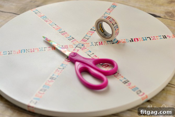 Applying washi tape to create sections on the homework station turntable
