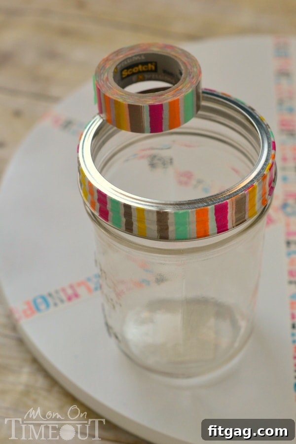 Decorating mason jar bands with washi tape for the homework station