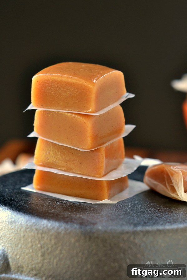 Close-up of soft, chewy Pumpkin Spice Caramels showcasing their buttery texture and rich color, ready to be enjoyed.