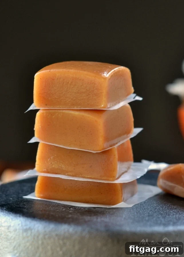 Neatly cut squares of Pumpkin Spice Caramels, ready for wrapping and sharing.