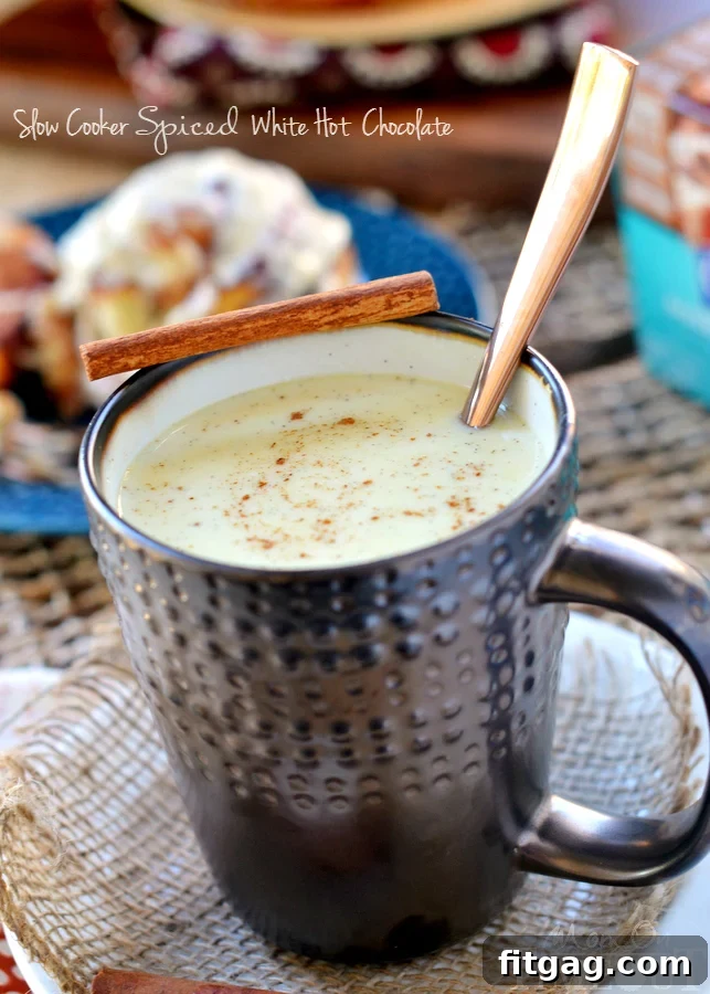 There's nothing better than this Slow Cooker Spiced White Hot Chocolate on a cool morning! | MomOnTimeout.com | #beverage #chocolate #hot #crock #pot #ad