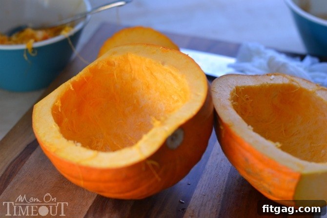 Cleaned pumpkin halves, with all seeds and pulp removed, ready for the next step in making slow cooker pumpkin puree.