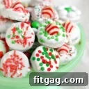 dipped oreo cookies decorated for chirstmas on green cake stand