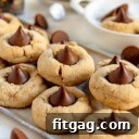 peanut butter blossoms stacked on metal serving tray