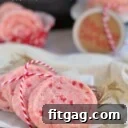 peppermint shortbread cookies with red and white twine laid on parchment with title overlay at top of image