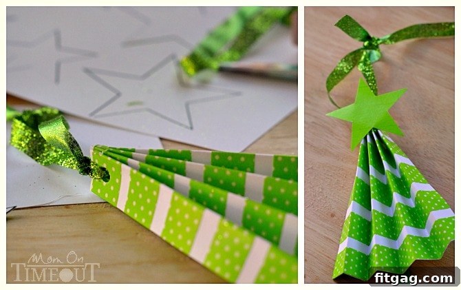 Finished accordion Christmas tree ornament with a star topper and hanging loop, ready to be displayed.