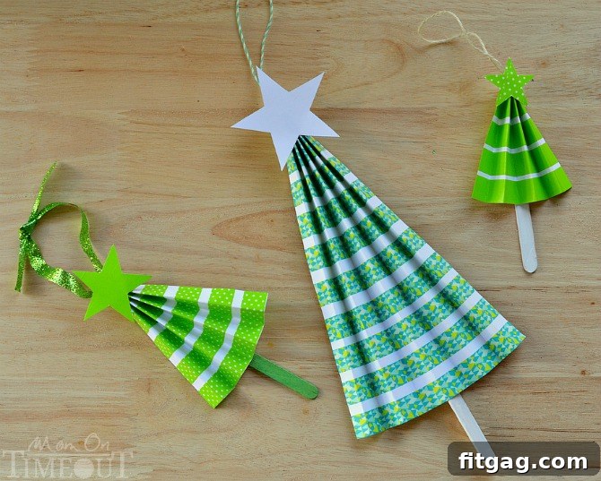 A collection of three colorful DIY accordion tree ornaments made with various washi tape patterns.