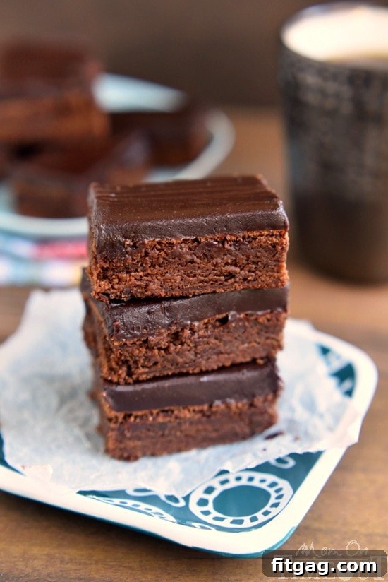 Velvet Mocha Truffle Brownies 3 Mocha Truffle Brownies featuring a rich coffee and chocolate base with a smooth ganache topping. A must-try dessert! | MomOnTimeout.com