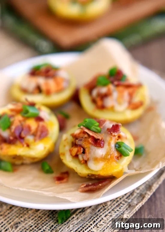 Monterey Chicken Potato Skins - an easy and delicious party appetizer featuring BBQ chicken, melted cheese, crispy bacon, and fresh green onions.