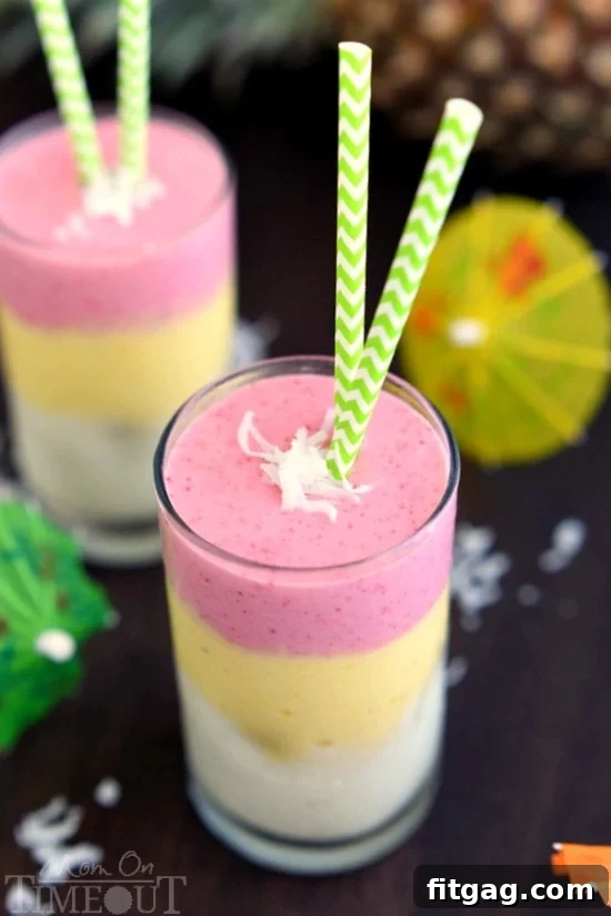 Sun-Kissed Paradise Smoothie 4 Three glasses of Tropical Sunrise Smoothie ready to be enjoyed, showing off the vibrant fruit layers.
