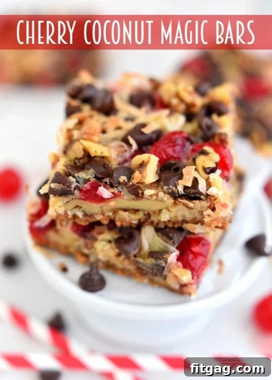 A charming display of Cherry Coconut Magic Bars on a serving platter, beautifully arranged and ready to be enjoyed. Highlight for any easy, delicious dessert recipe.