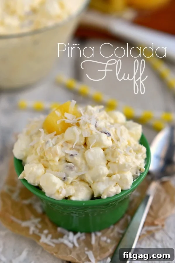 Pina Colada Fluff, a one-bowl, dump-and-go dessert salad that's incredibly easy and delicious, with wonderful pineapple and coconut flavors. Perfect for potlucks or parties.