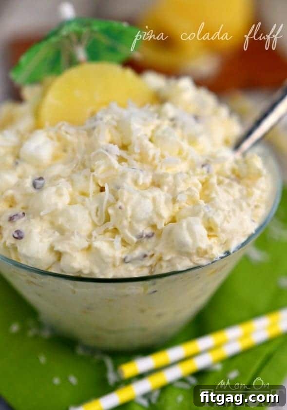 Pina Colada Fluff - An easy, delicious, and tropical dessert salad with pineapple and coconut.
