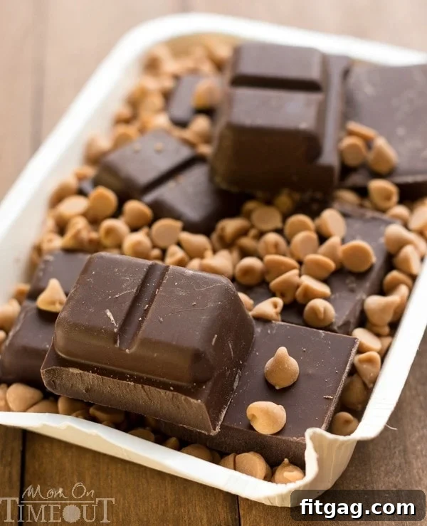 Melting chocolate CandiQuik with Reese's peanut butter chips for the Muddy Buddies coating.