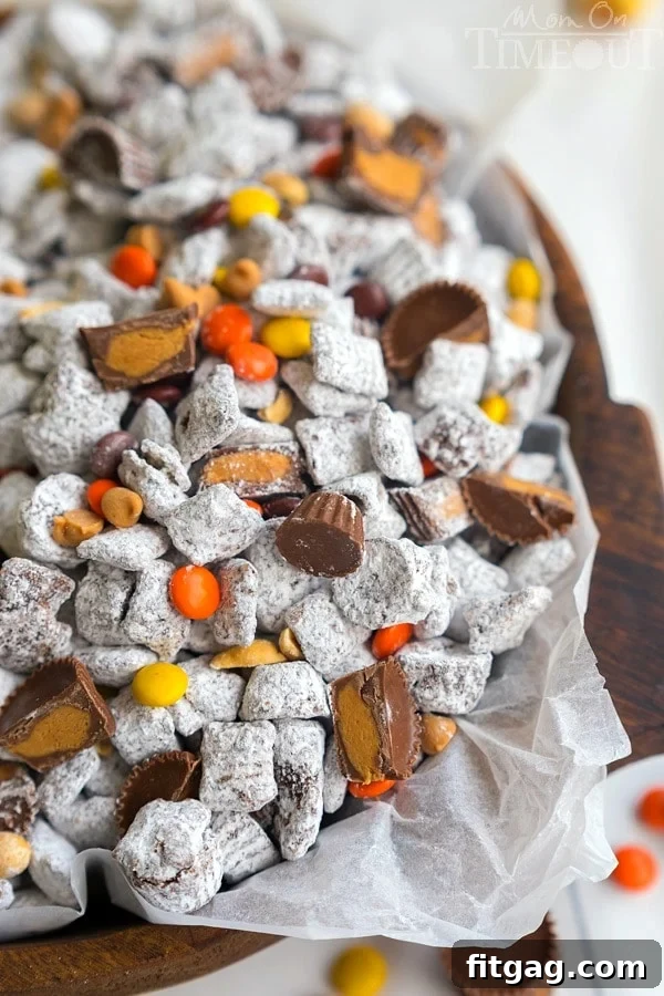 A bowl overflowing with the ultimate Reese's Muddy Buddies, ready to be enjoyed.