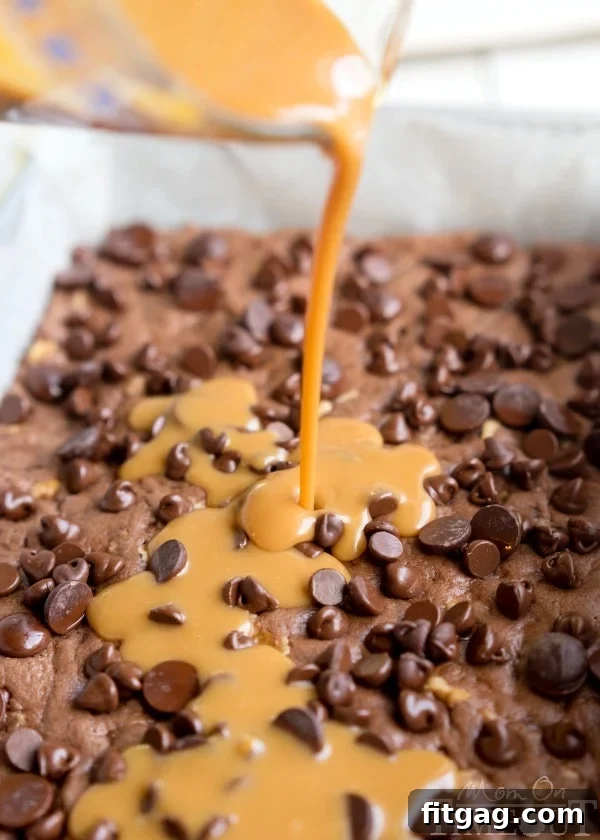A delicious brownie with caramel peeking through cracks on top