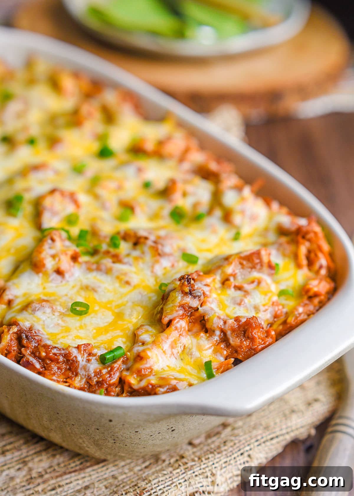 Loaded BBQ pulled pork potato casserole in a large baking dish, ready to be served.