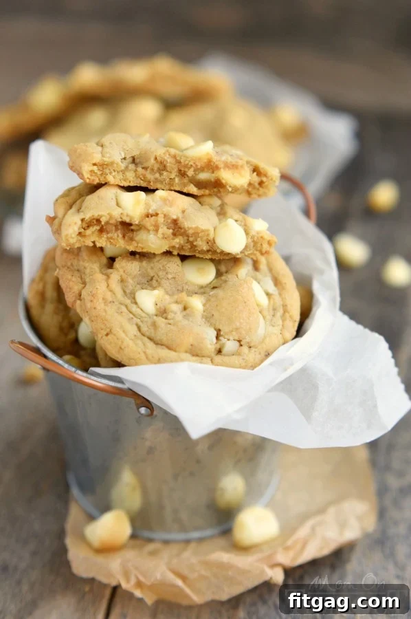 These insanely delicious Brown Butter White Chocolate Macadamia Nut Cookies are guaranteed to be a new favorite! Super easy to make and mouth watering good! This easy cookie recipe is one you will find yourself making over and over...| MomOnTimeout.com