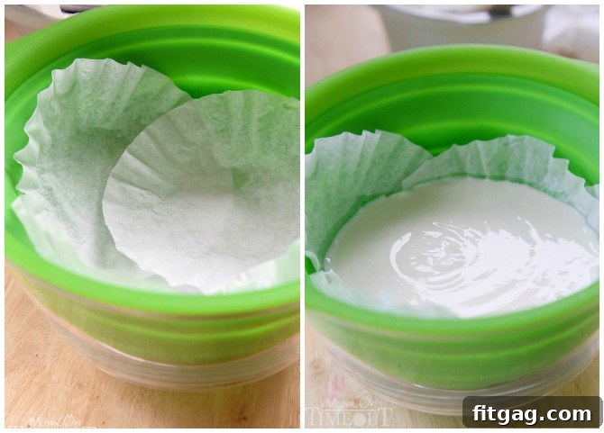 Yogurt straining in a colander lined with coffee filters