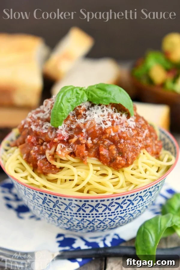 This easy homemade Spaghetti Sauce recipe is perfect for busy weeknights! Made in the slow cooker, this delicious spaghetti sauce is full of flavor and makes a large batch which is great for freezing. Enjoy with your family tonight! Make it with or without meat - your choice! // Mom On Timeout #spaghetti #sauce #recipe #dinner #easy #recipes #slowcooker #crockpot Delicious Slow Cooker Spaghetti Sauce