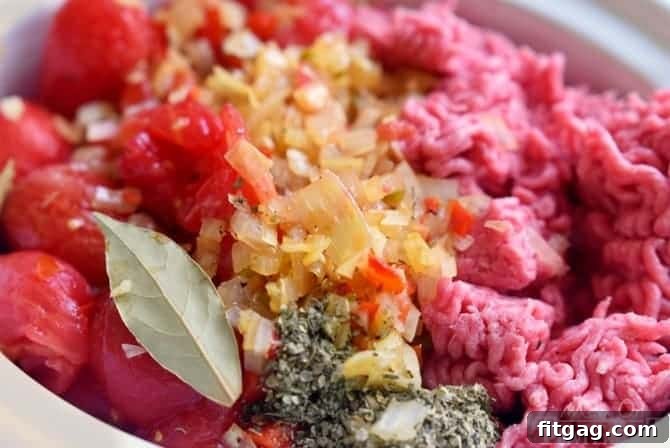 This easy homemade Spaghetti Sauce recipe is perfect for busy weeknights! Made in the slow cooker, this delicious spaghetti sauce is full of flavor and makes a large batch which is great for freezing. Enjoy with your family tonight! Make it with or without meat - your choice! // Mom On Timeout #spaghetti #sauce #recipe #dinner #easy #recipes #slowcooker #crockpot Spaghetti Sauce Ingredients