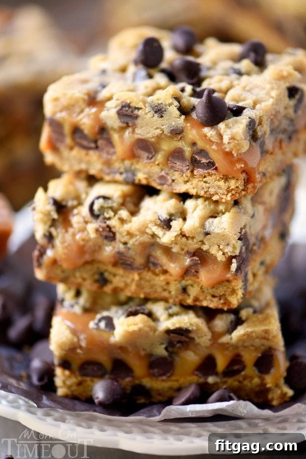 Delicious Carmelitas stacked on a plate with gooey caramel oozing out