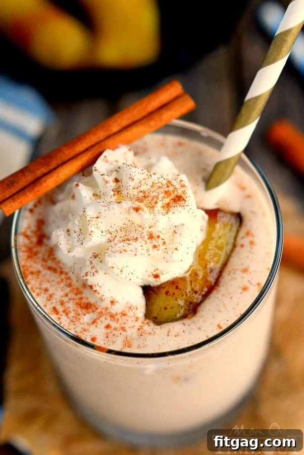 Delicious Bananas Foster Smoothie topped with whipped cream and cinnamon. Yummy banana and caramel flavors in a protein-packed smoothie - an easy and sweet breakfast recipe. | MomOnTimeout.com