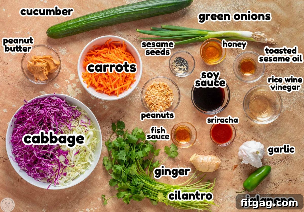 Thai Peanut Salad with Crunchy Veggies and Lime Dressing 6 Overhead shot of thai salad and thai peanut dressing ingredients laid out on surface and labeled.