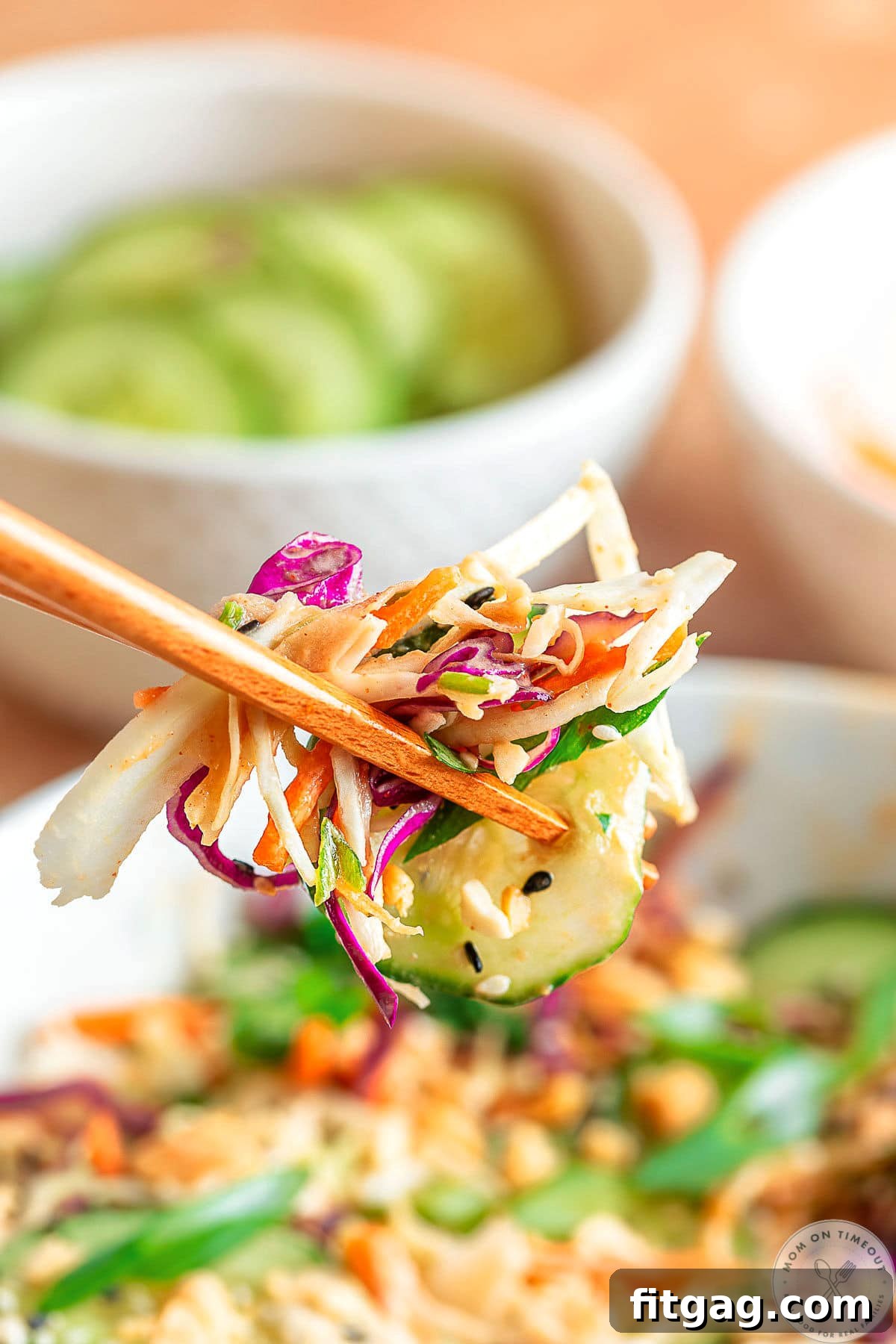 Thai Peanut Salad with Crunchy Veggies and Lime Dressing 8 Thai salad recipe being eaten with chopsticks.
