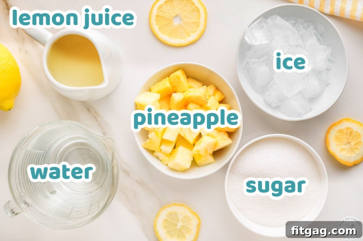 Overhead shot of pineapple lemonade ingredients laid out, labeled, and ready to be used in the recipe.